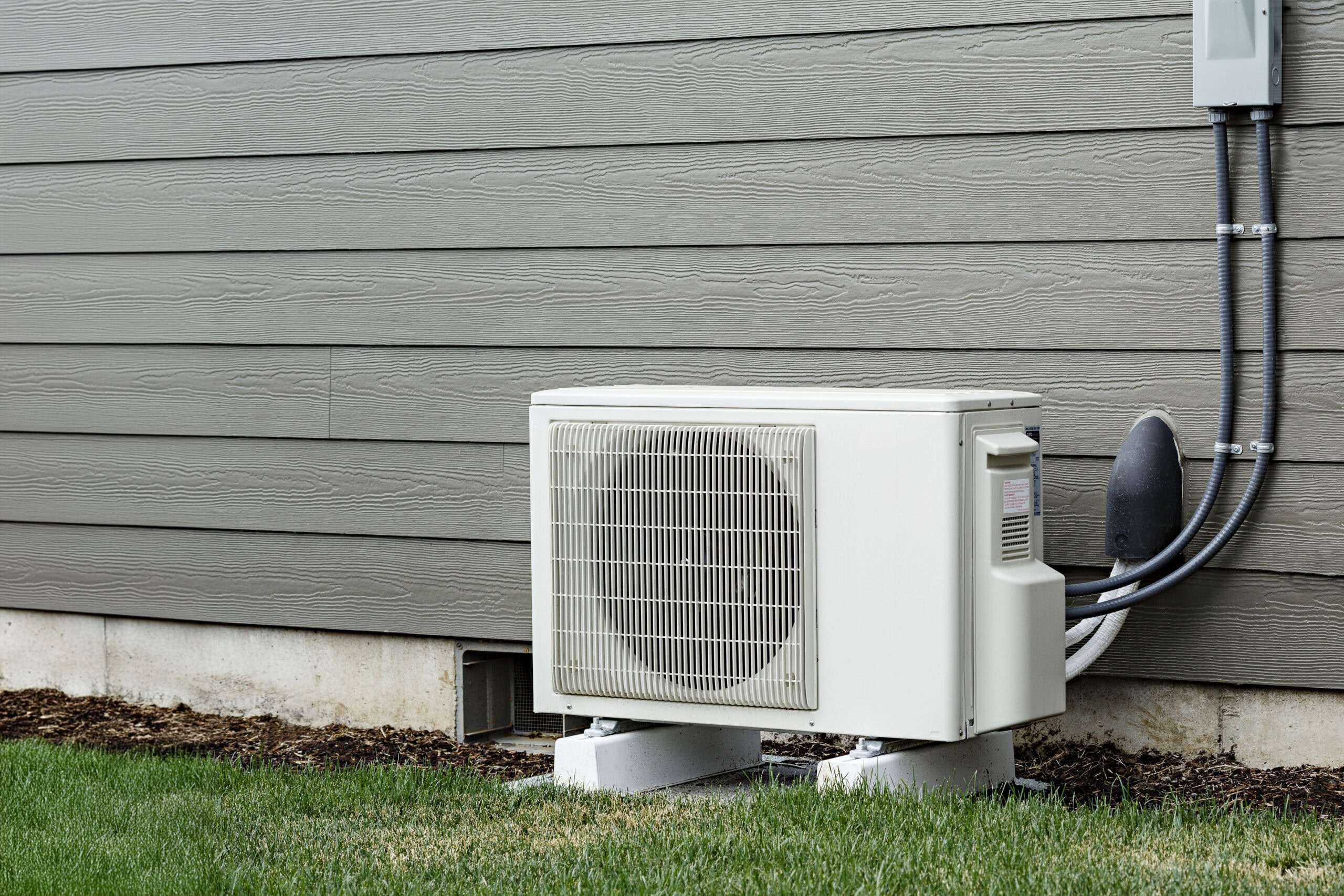 Mini split outdoor condenser unit connected to an indoor system for efficient ductless comfort