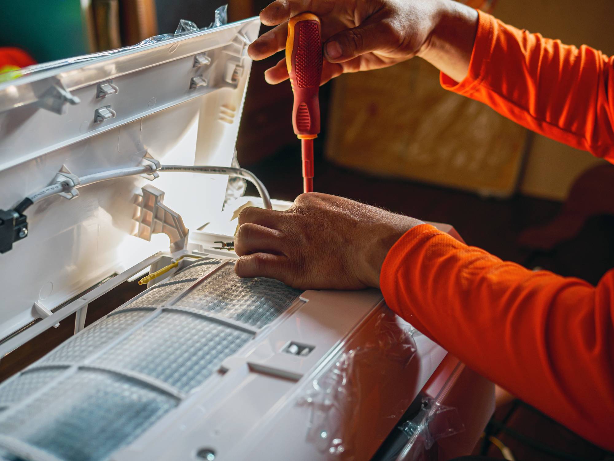 Heating and cooling technician completing preventive maintenance in Des Plaines, IL